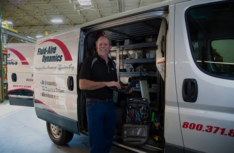 Fluid-Aire Dynamics technician for metal plant air compressor repair
