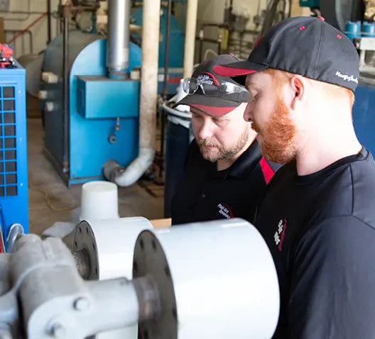 Air compressor installation in a metal fabrication shop
